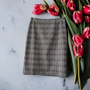 Size small plaid skirt with red accent. Stretchy